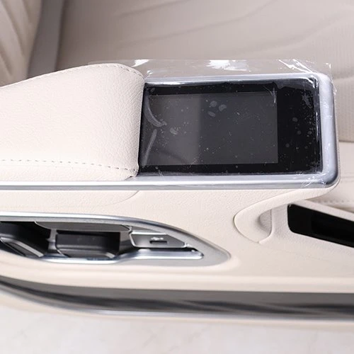 Touch control screen on the armrest of the van seat Touch control screen on the armrest of the van seat