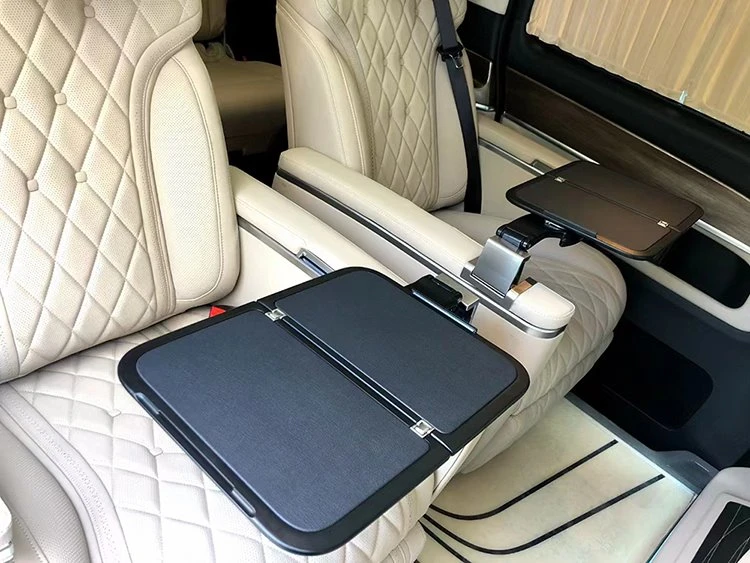 Folding table board installed on the armrest of individual seat in van Folding table board installed on the armrest of individual seat in van